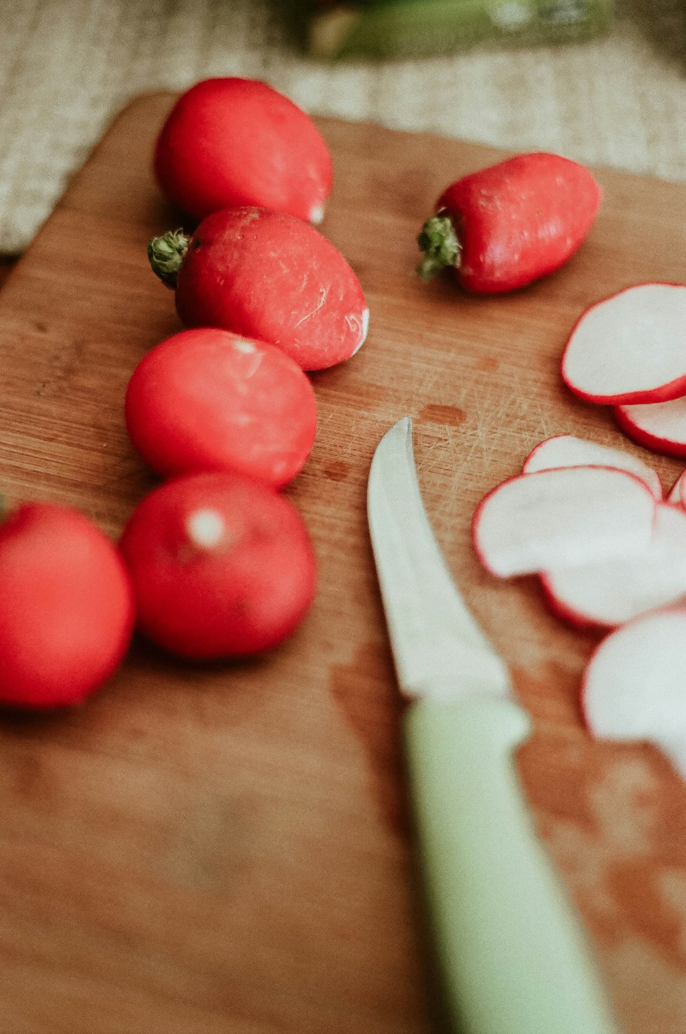 red round fruits on brown wooden table