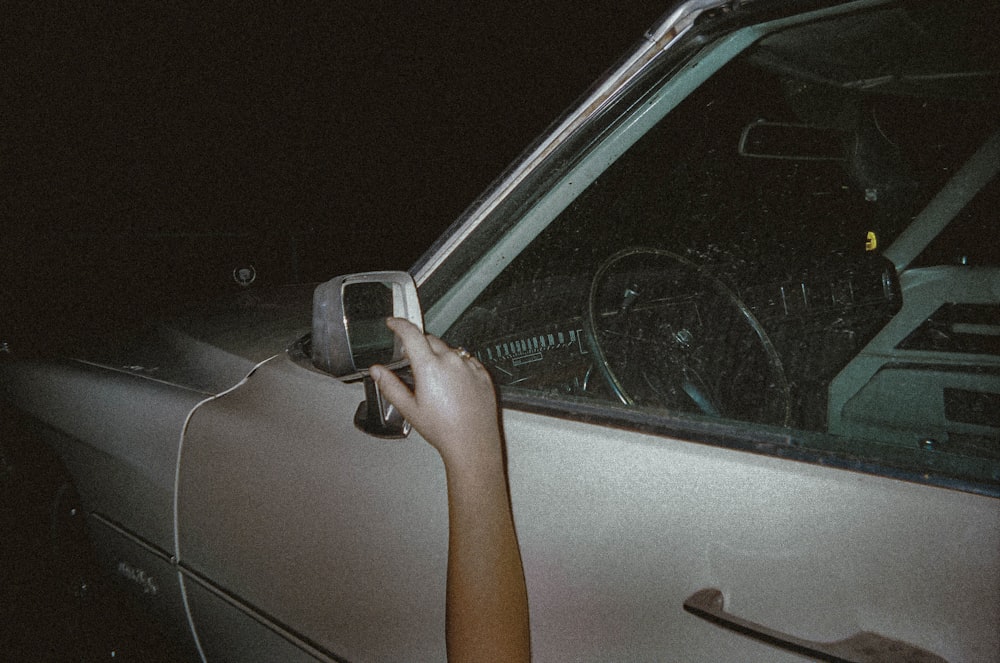 person in car during night time