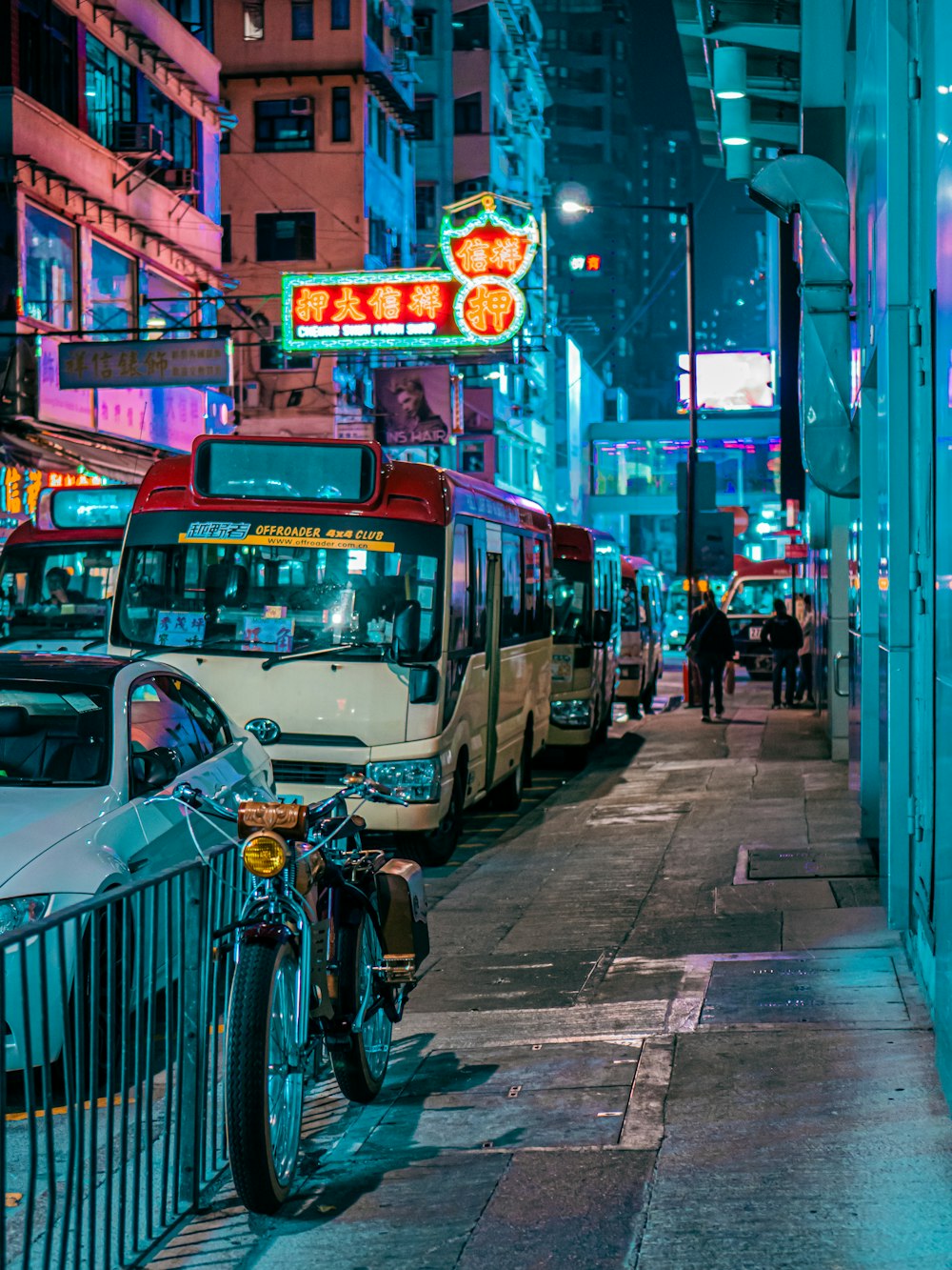 red and white bus on road during night time