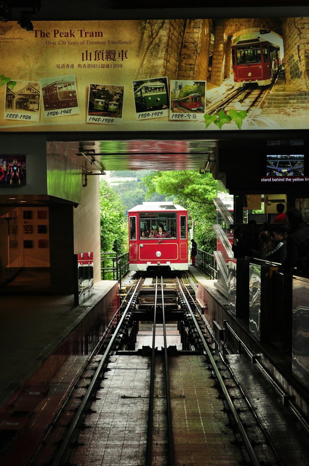 red train on train station during daytime