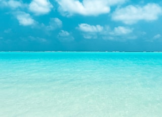 blue sky and white clouds over the sea