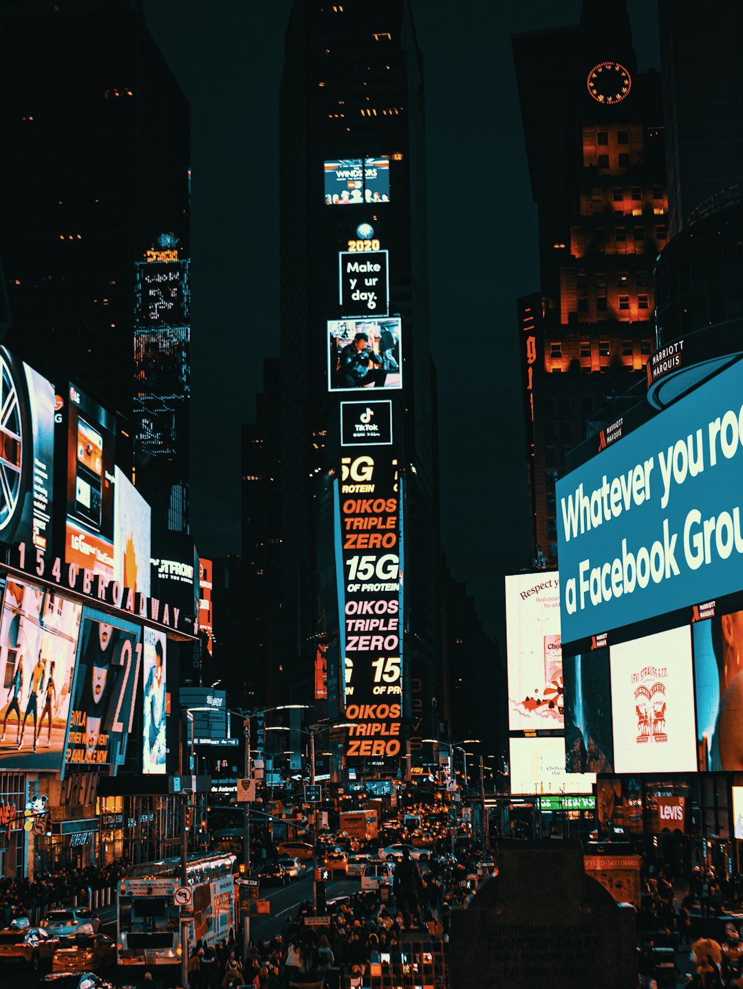 people walking on street during night time