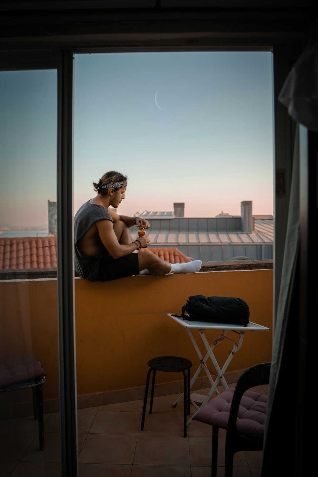 woman in black tank top sitting on chair