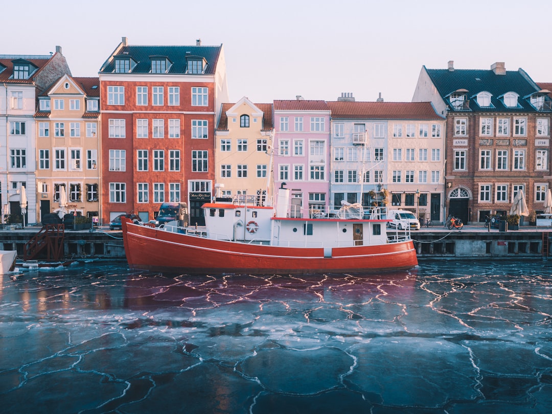 red and white boat on water, Golden light revealing the ice