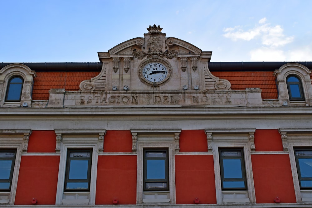 white and red concrete building under blue sky during daytime