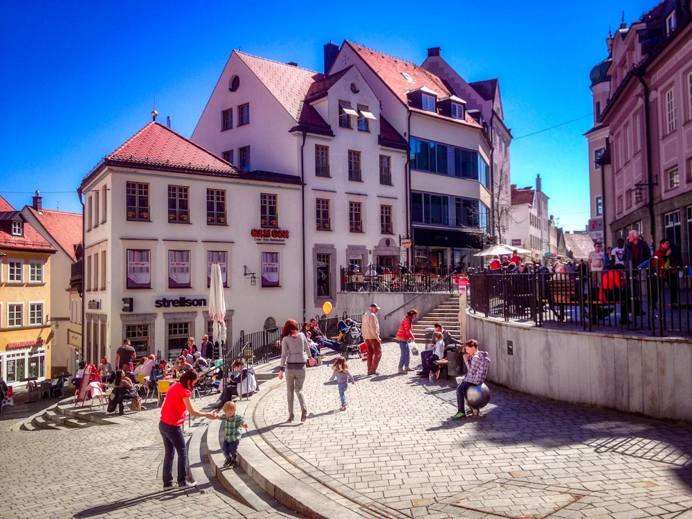 people walking on street near buildings during daytime