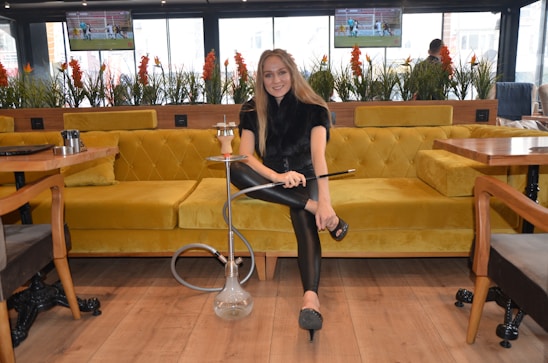 A cozy lounge area with comfortable seating and ambient lighting, perfect for enjoying hookah.