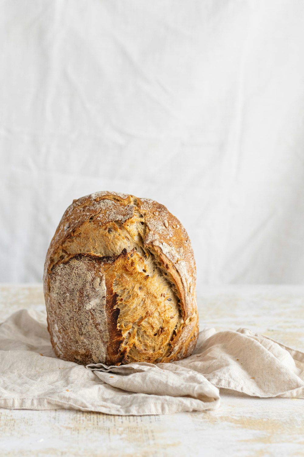 brown bread on white textile