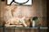 Elegant wooden statue of an African animal, polished to a smooth finish, displayed on a shelf.
