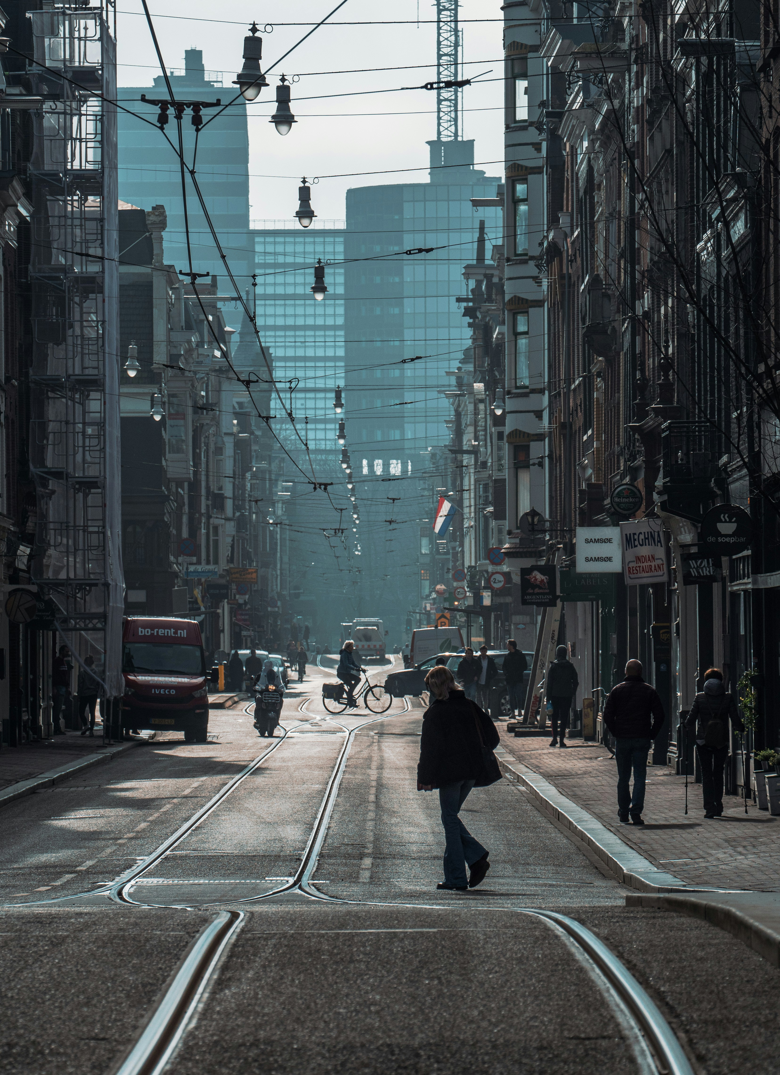 The Utrechtsestraat in Amsterdam, the Netherlands, with a woman crossing the street