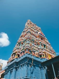 brown and blue concrete building under blue sky during daytime