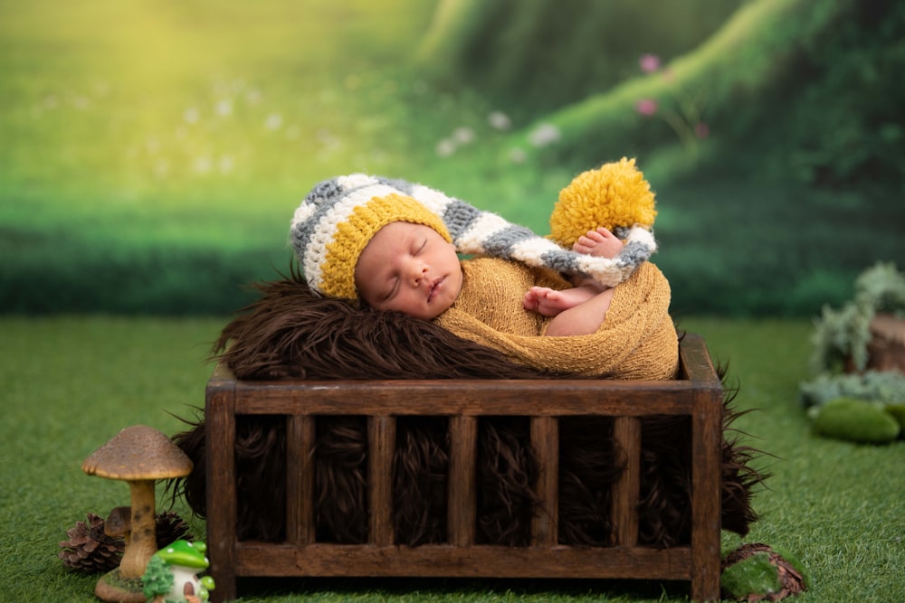 girl in brown knit sweater lying on brown wooden bench during daytime