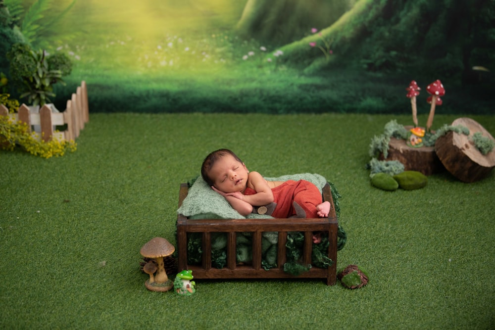 2 boys lying on brown wooden bench