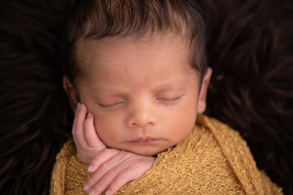 child in yellow knit shirt