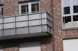 A stylish outdoor roller shutter installed on a modern balcony.