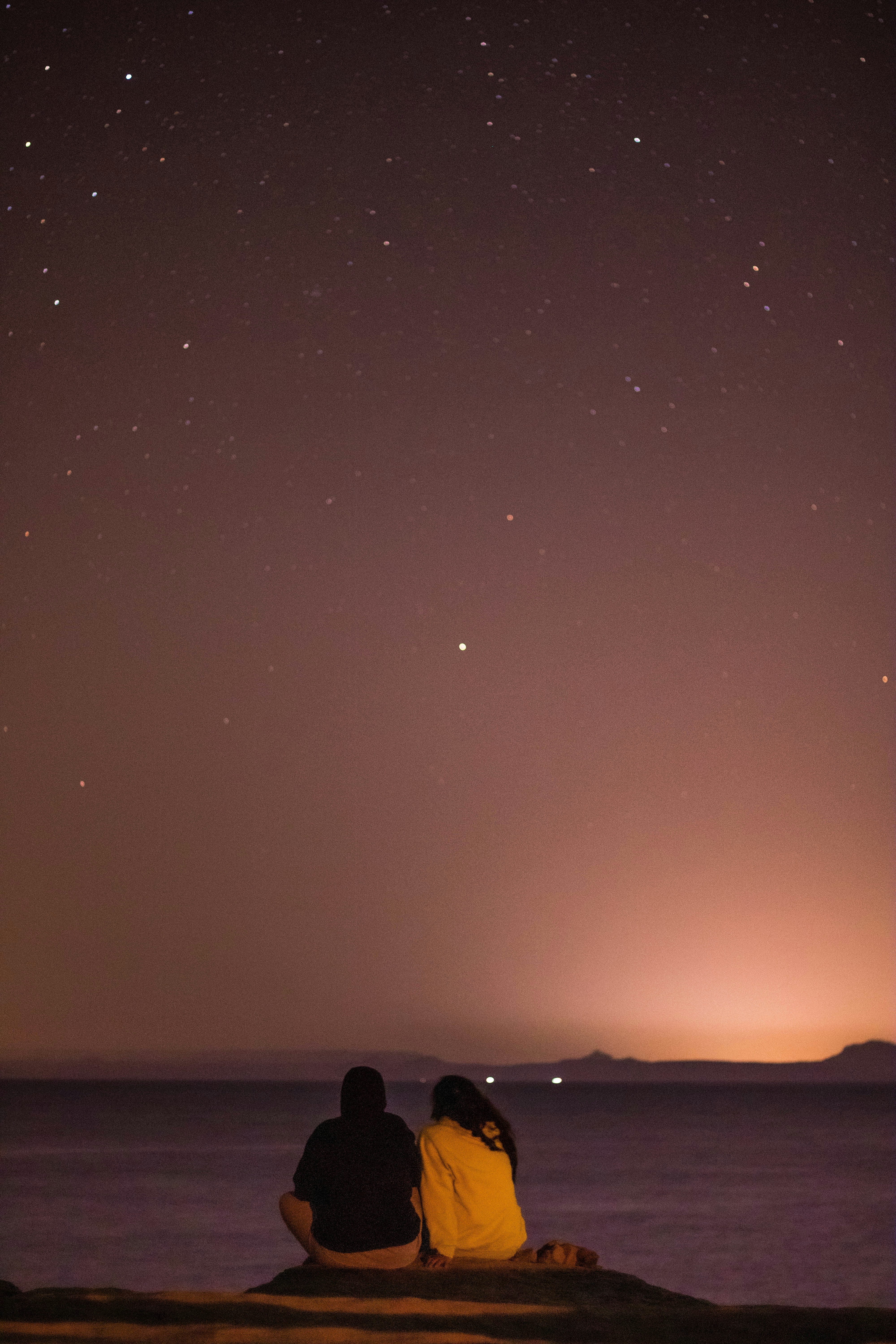 silhouette of people on beach during sunset