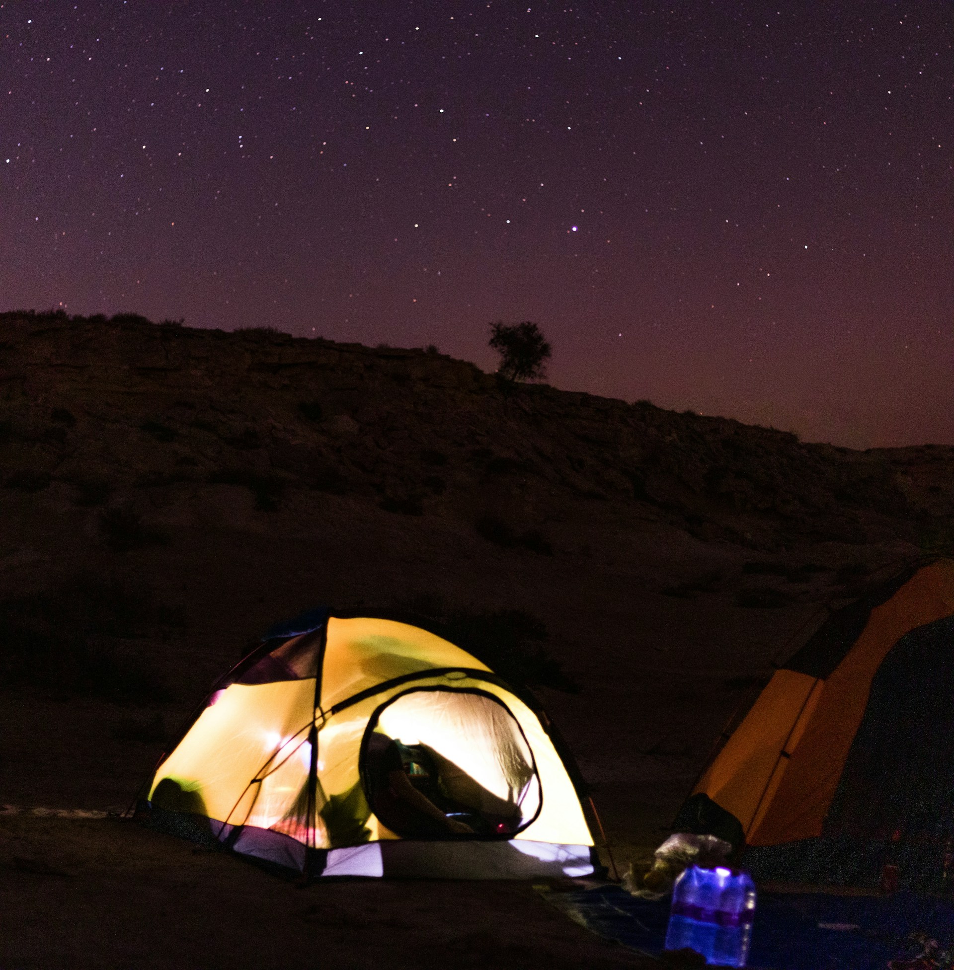tent under starry night sky