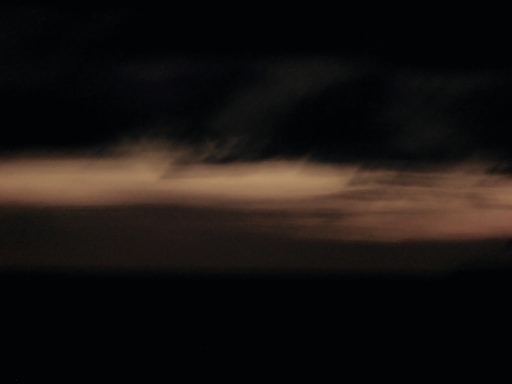 A sleek, dark-toned abstract image with subtle light and shadow textures suggesting connection and clarity.