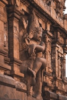 brown concrete statue of man