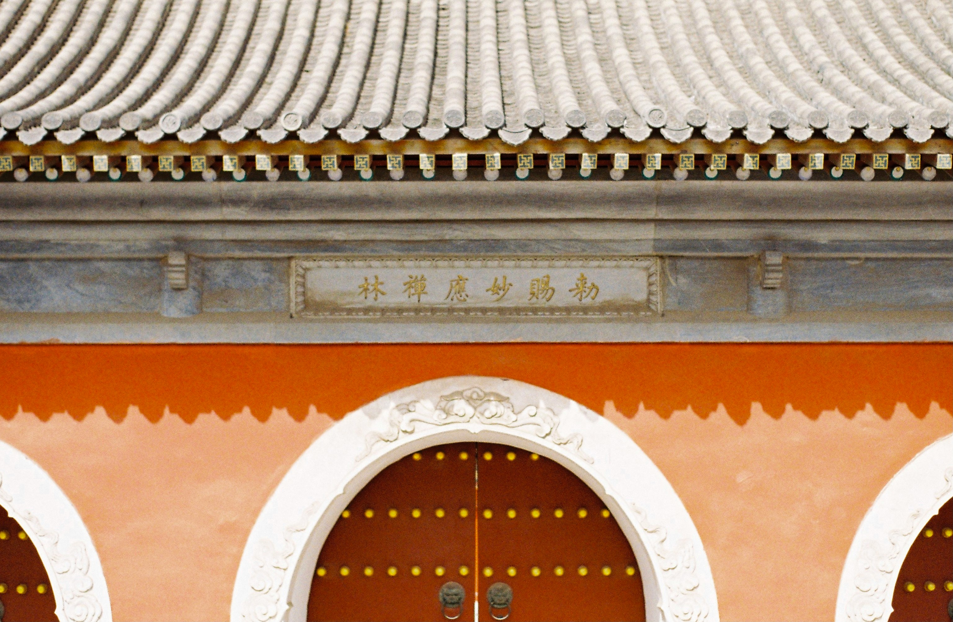 brown wooden door on brown concrete building