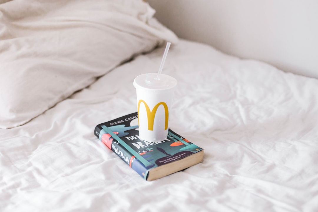 white ceramic mug on book