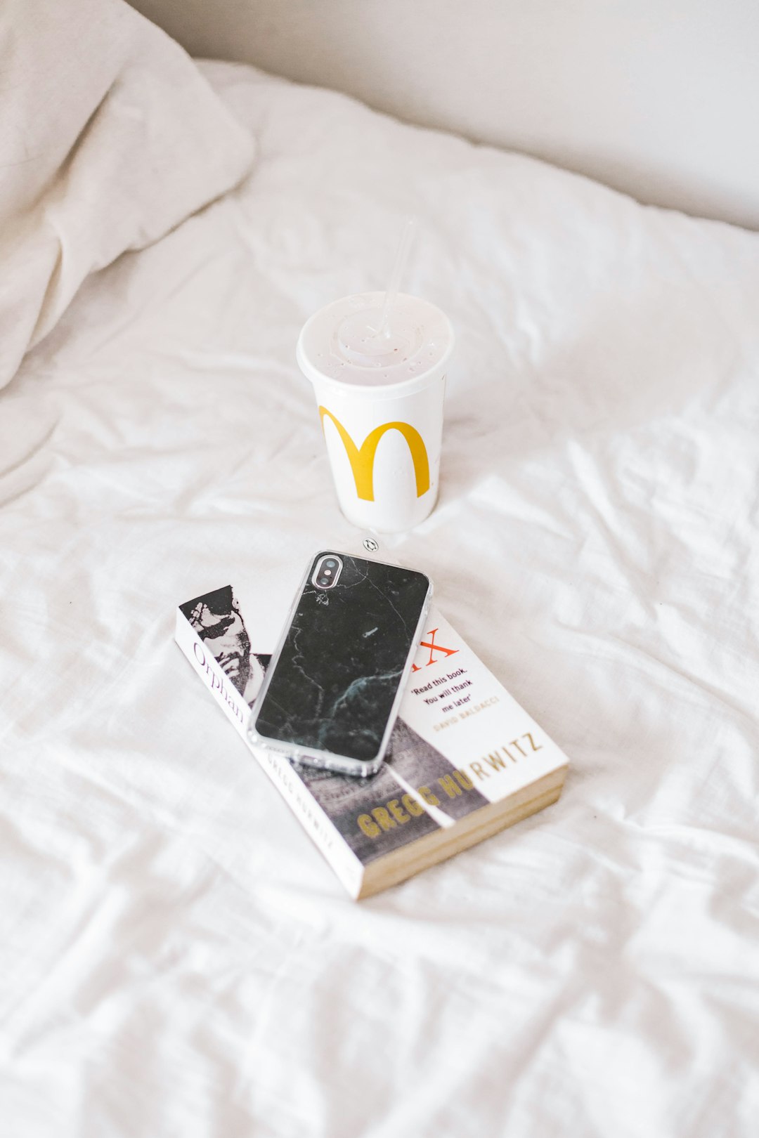 white and black marlboro cigarette pack beside white ceramic mug