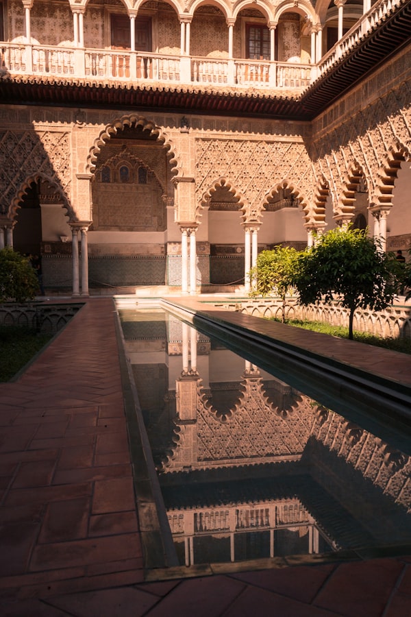Andalusian architecture with green trees and historic building