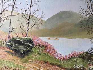 red flowers beside body of water during daytime