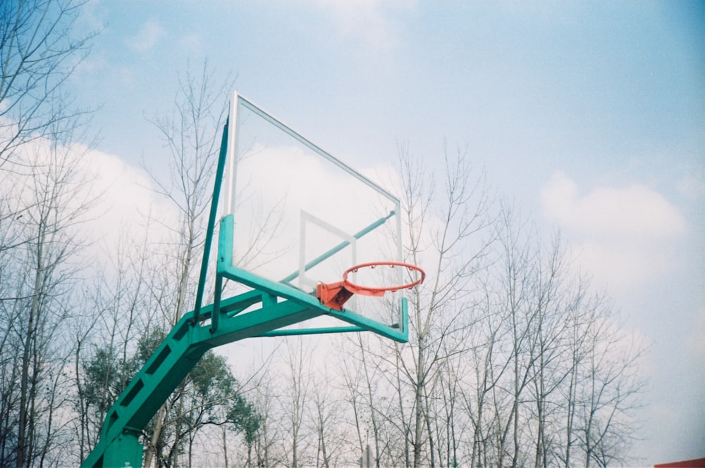 basketball hoop under cloudy sky during daytime