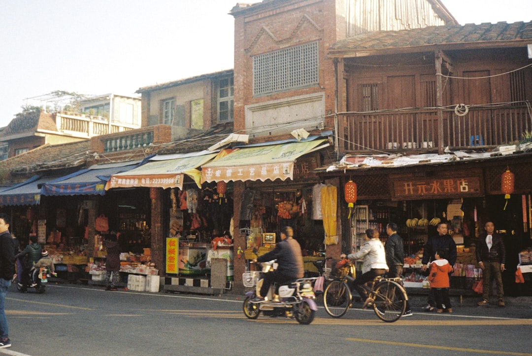 people riding bicycles on street during daytime