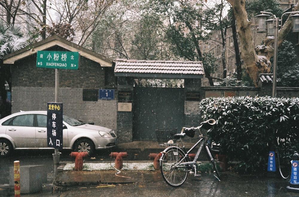 white sedan parked beside white sedan during daytime