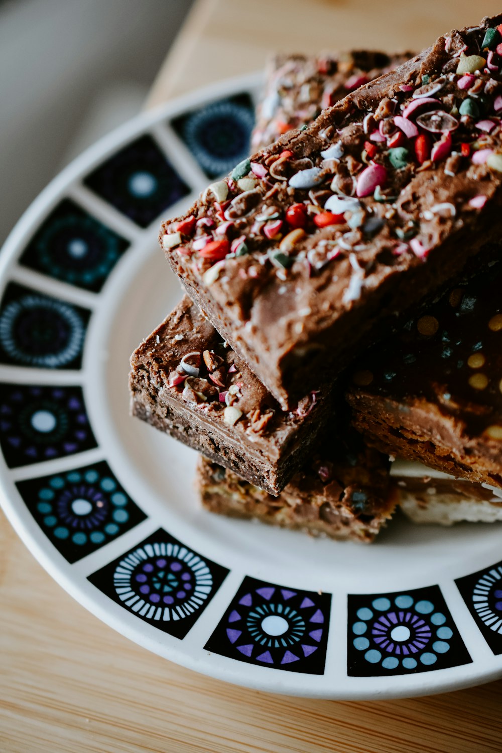 chocolate cake on white and blue ceramic plate