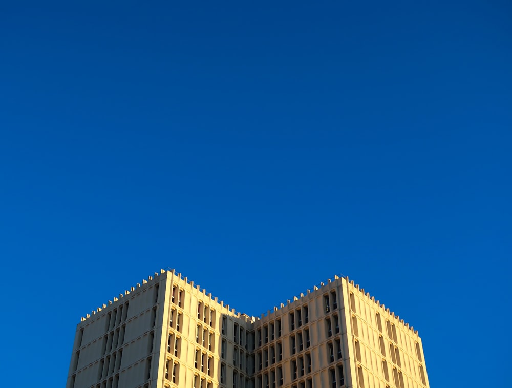 white and blue concrete building under blue sky during daytime