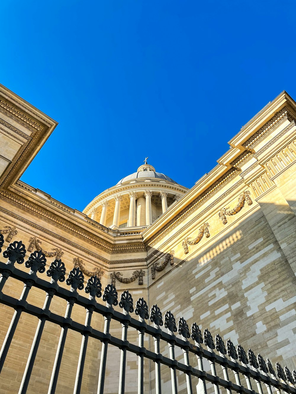 white concrete building under blue sky during daytime