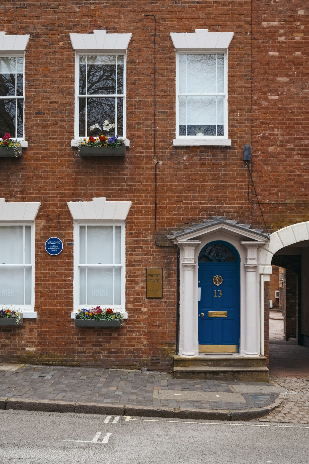 brown brick building with blue wooden door