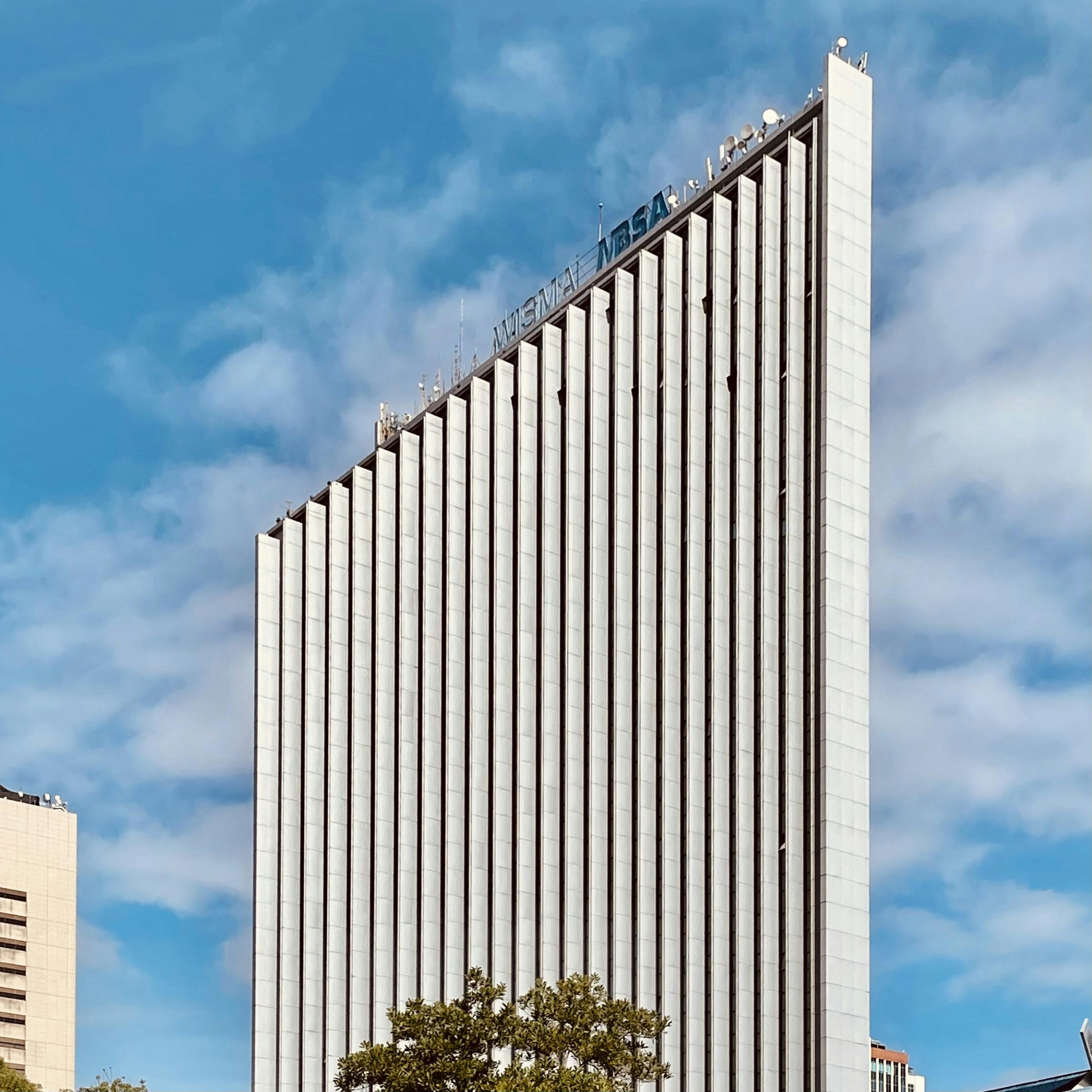 white concrete building under blue sky during daytime