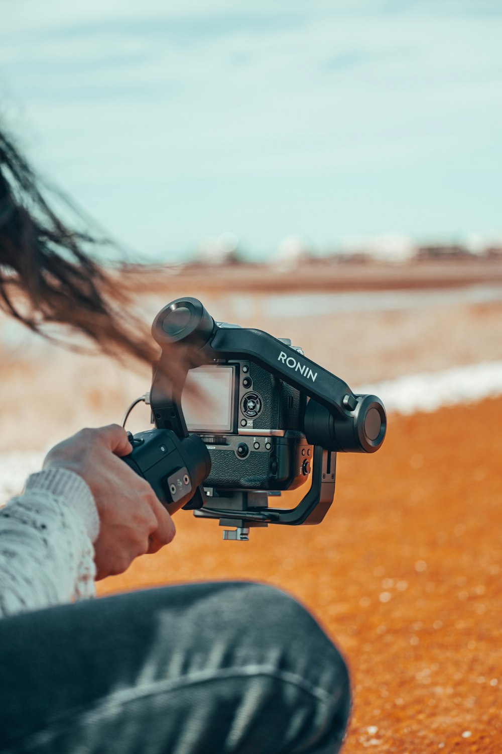 person holding black nikon dslr camera