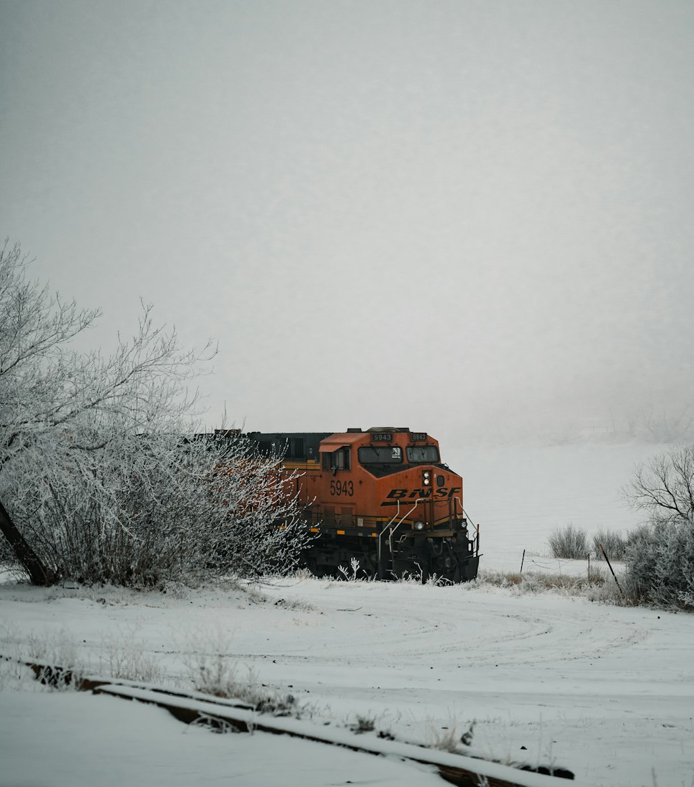 brown train on snow covered ground during daytime