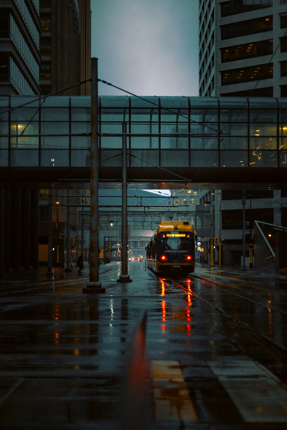 yellow and black bus on road during night time