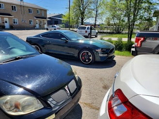 A diverse selection of used cars parked in a sunny outdoor lot.