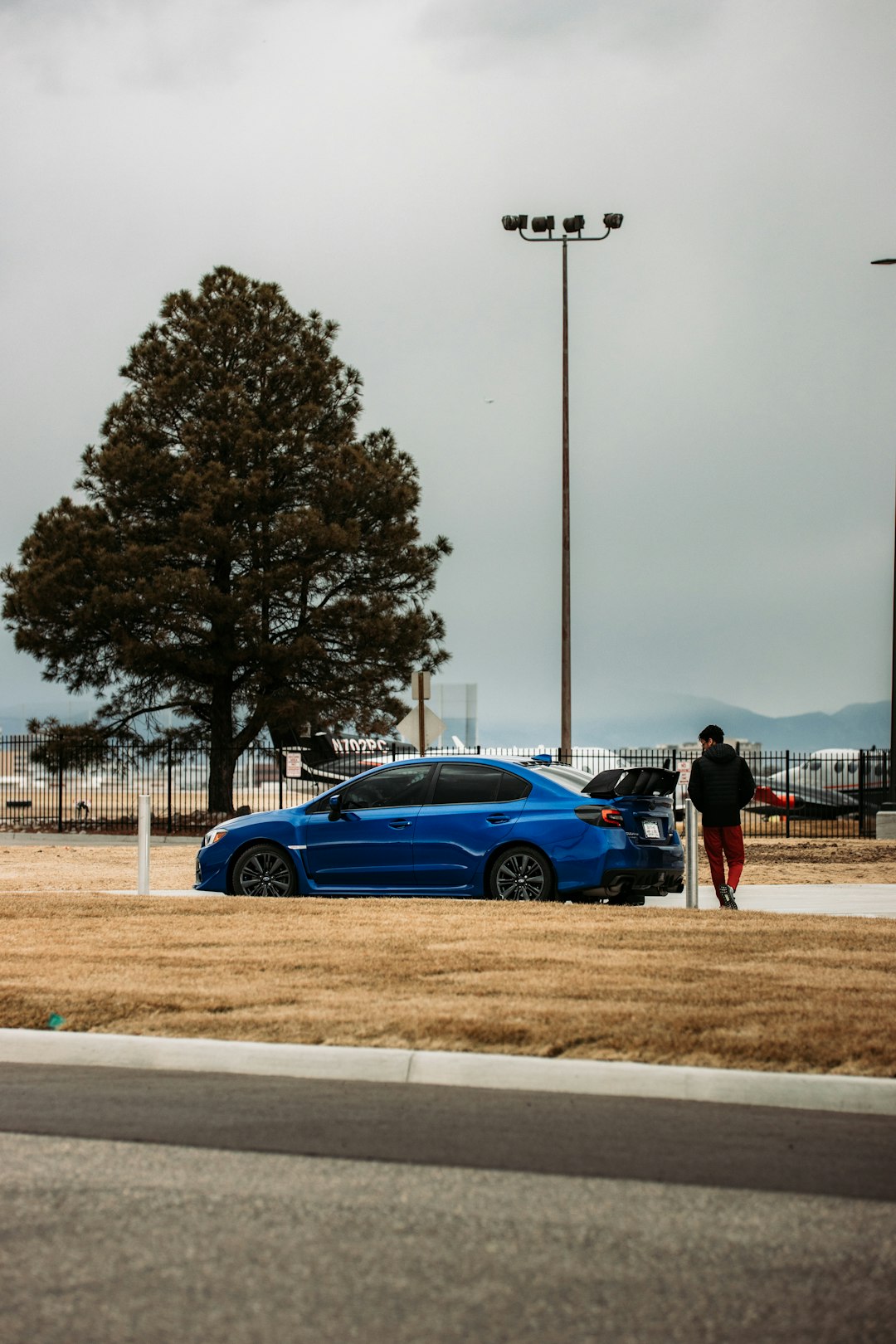 blue coupe on road during daytime
