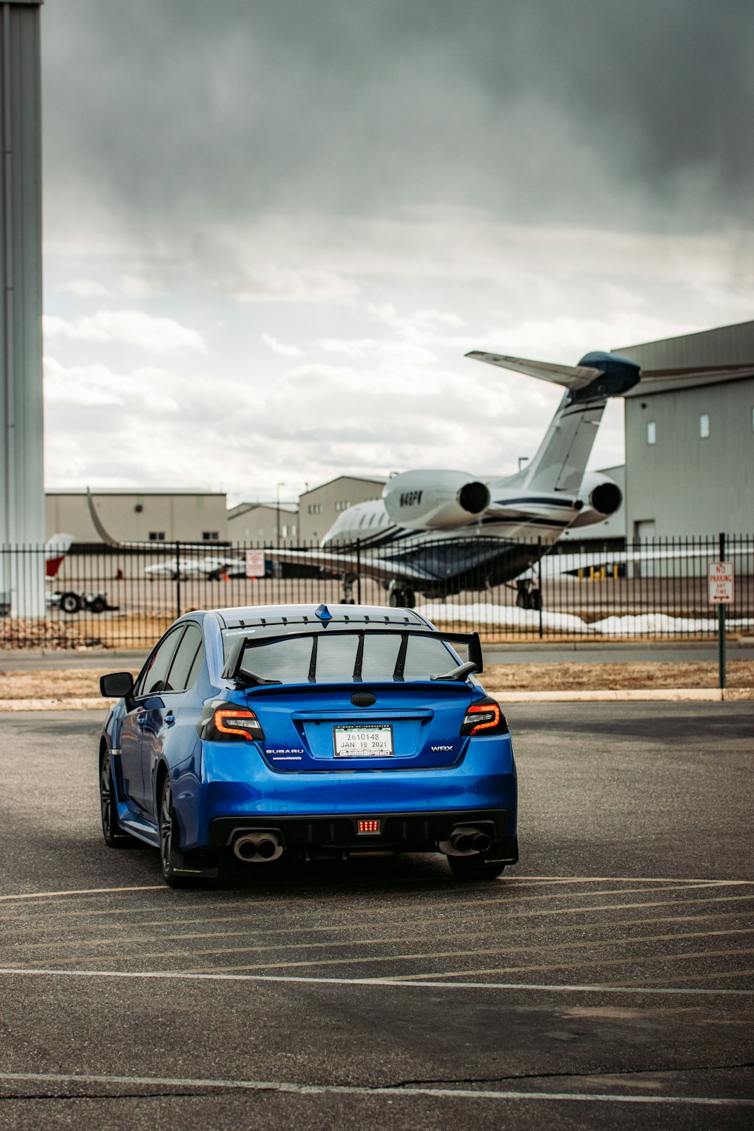 blue bmw m 3 parked on airport during daytime