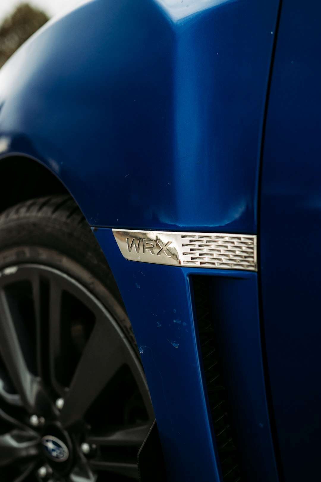 blue car with yellow and black license plate