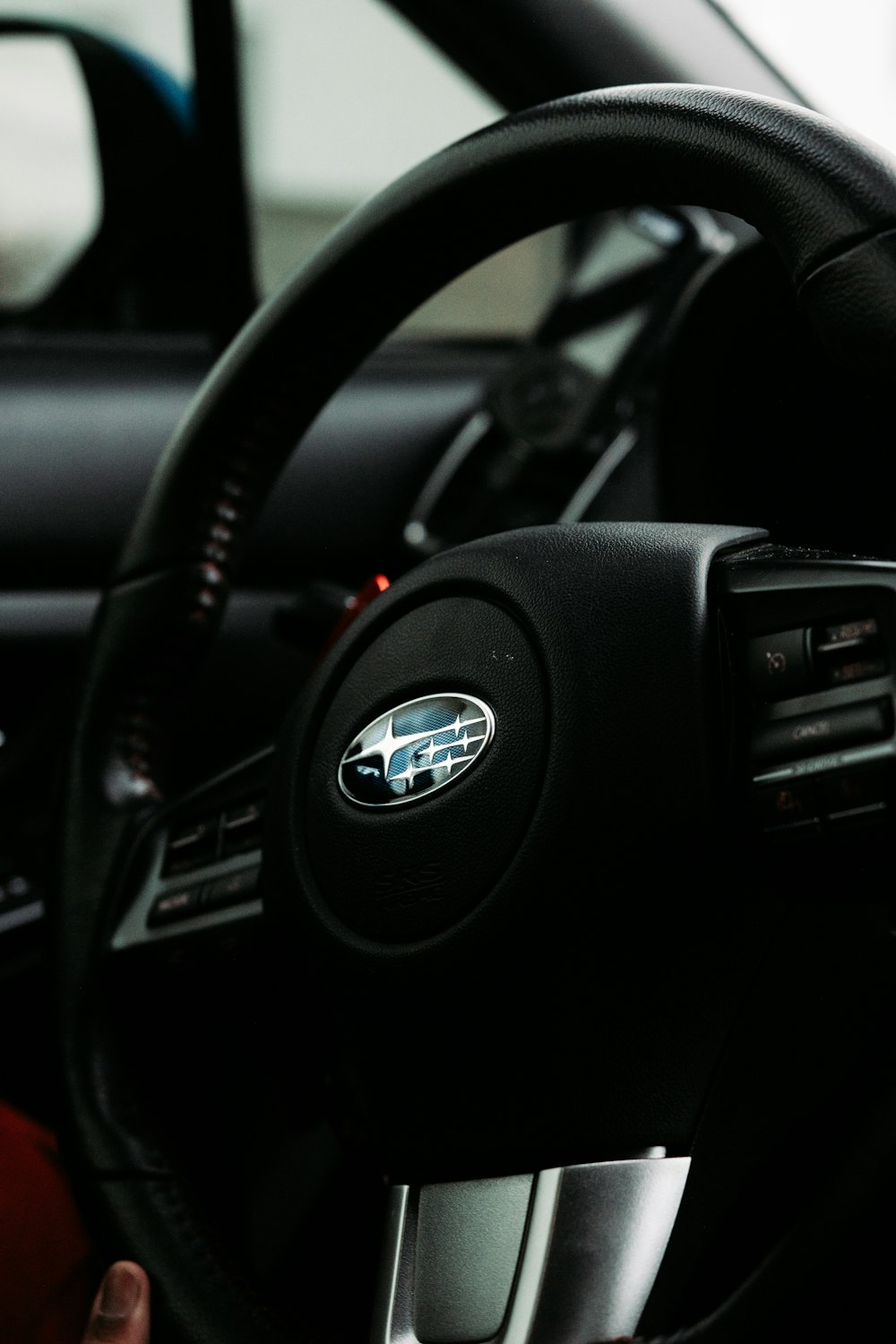 black nissan car steering wheel