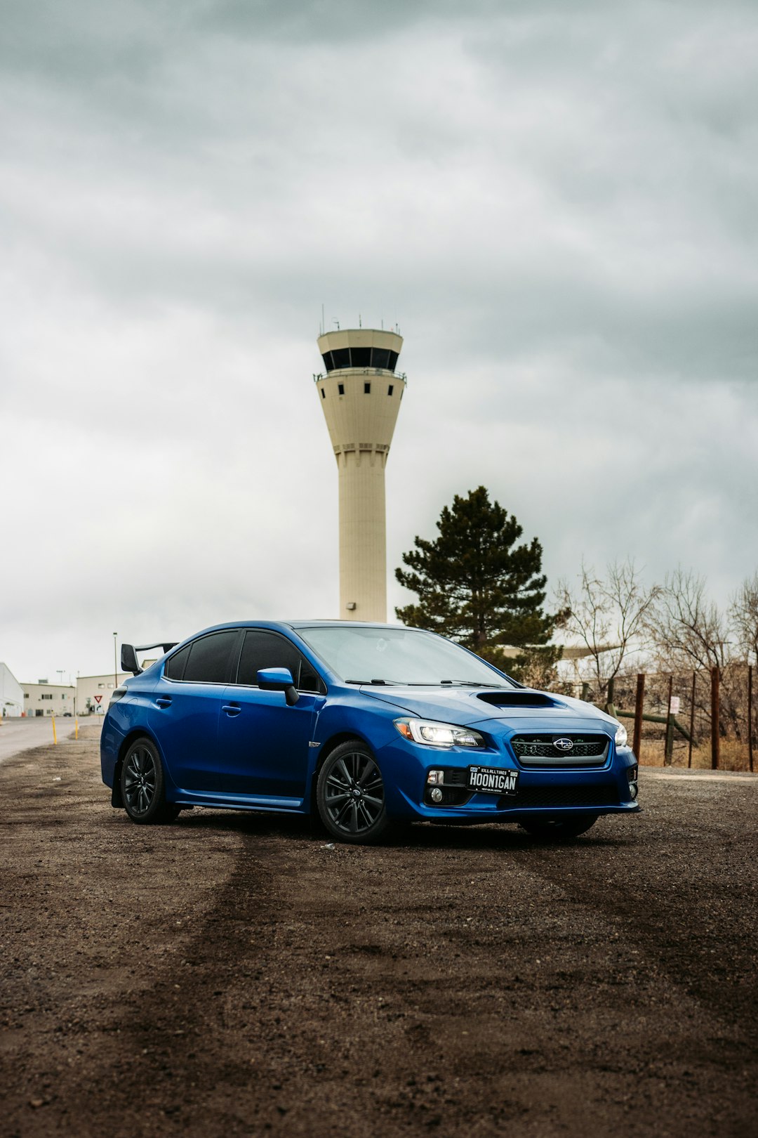 blue bmw m 3 coupe parked on gray concrete road during daytime