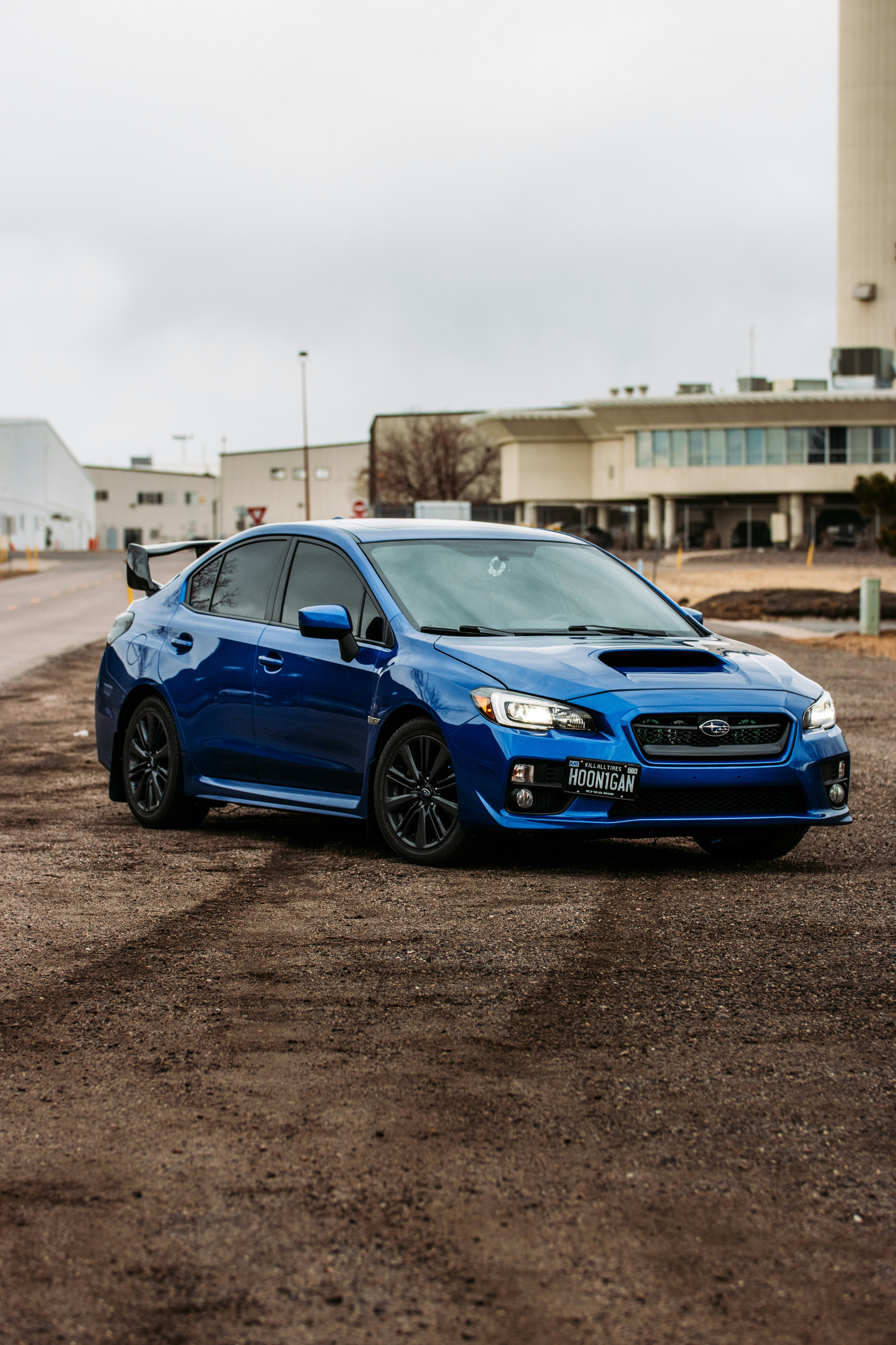 blue honda sedan on road during daytime