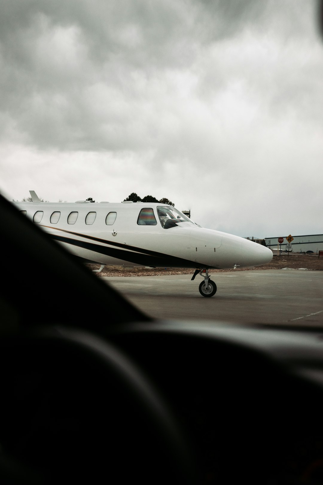 white airplane on airport during daytime