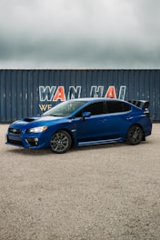 A sleek Japanese car being unloaded from a shipping container.