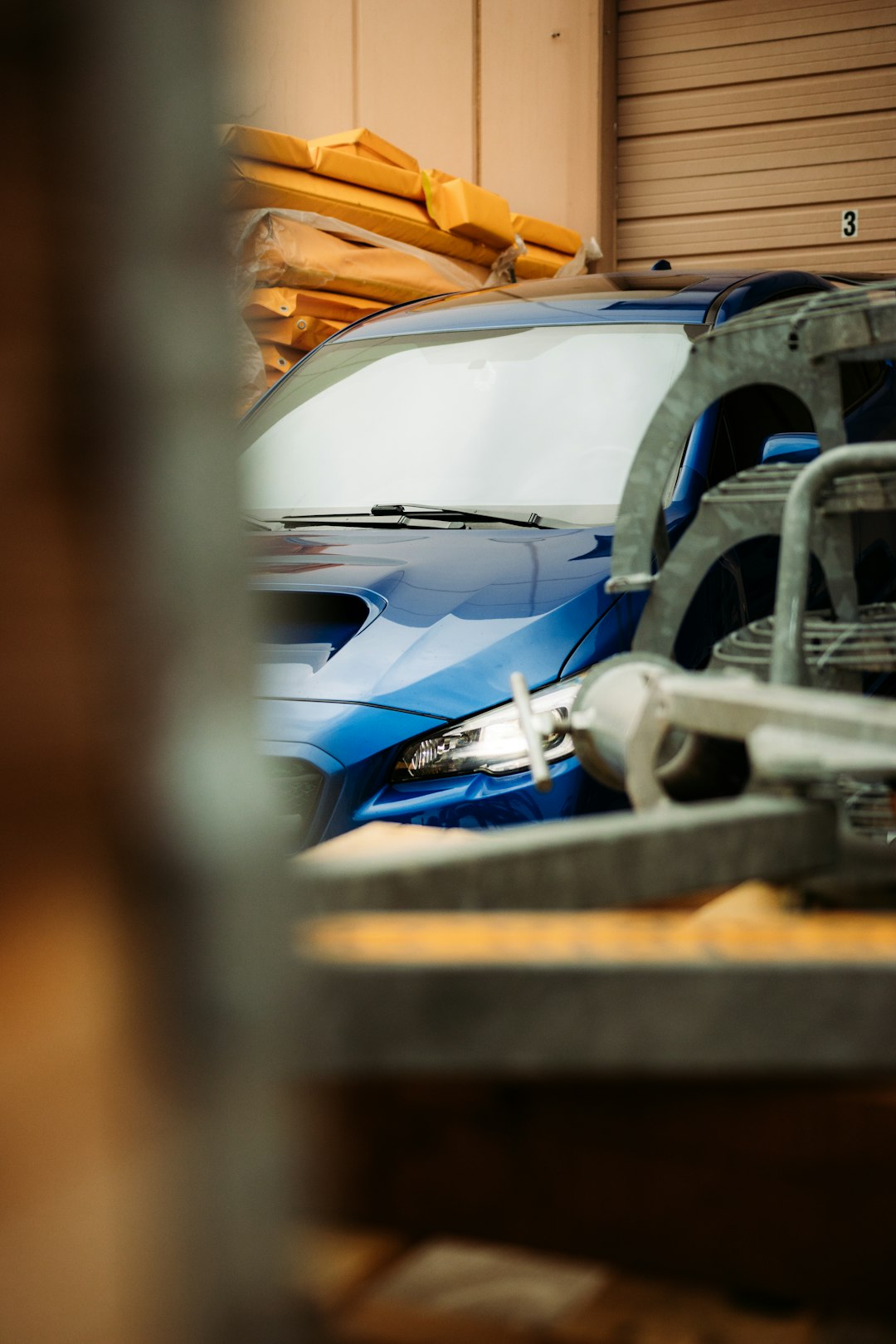 blue and white car in a parking lot