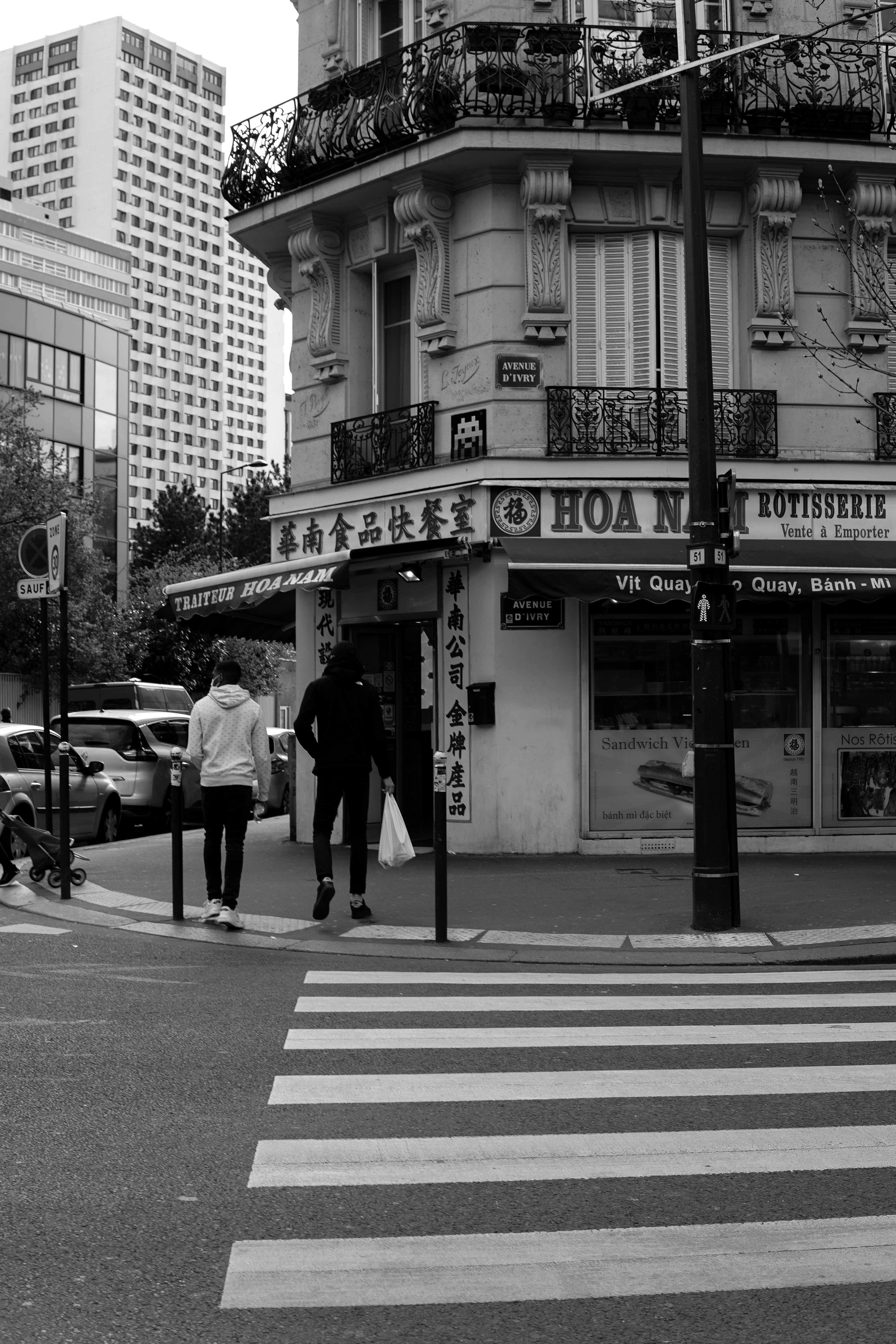 grayscale photo of people walking on pedestrian lane